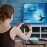 women playing videogame